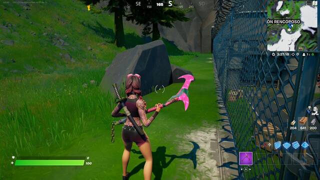 Fortnite Battle Royale - Coloca micros en ubicaciones clave - CONFIDENCIAL, junto a la roca al norte de la valla